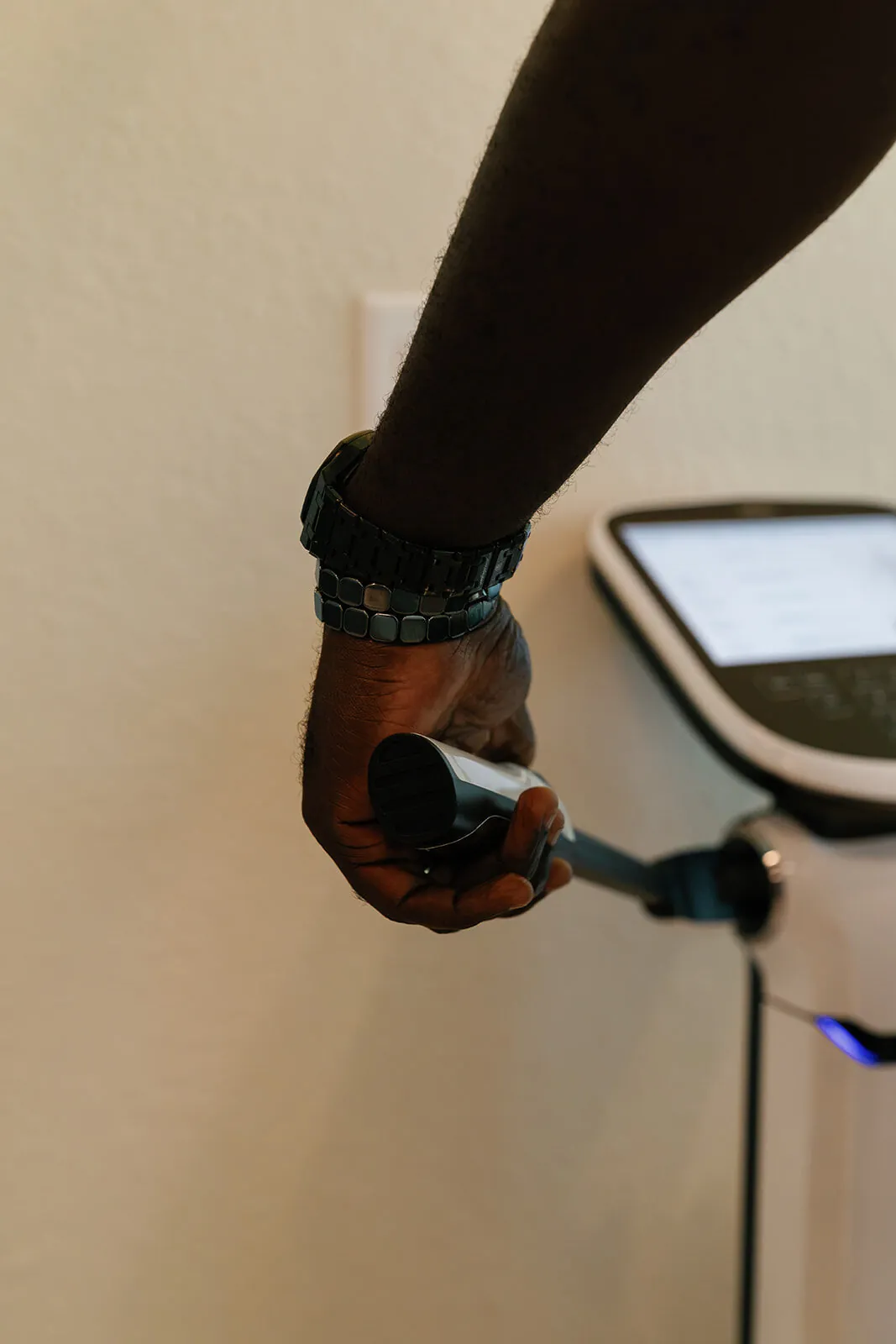 Client holding the hand electrodes during an InBody scan at OutRecover