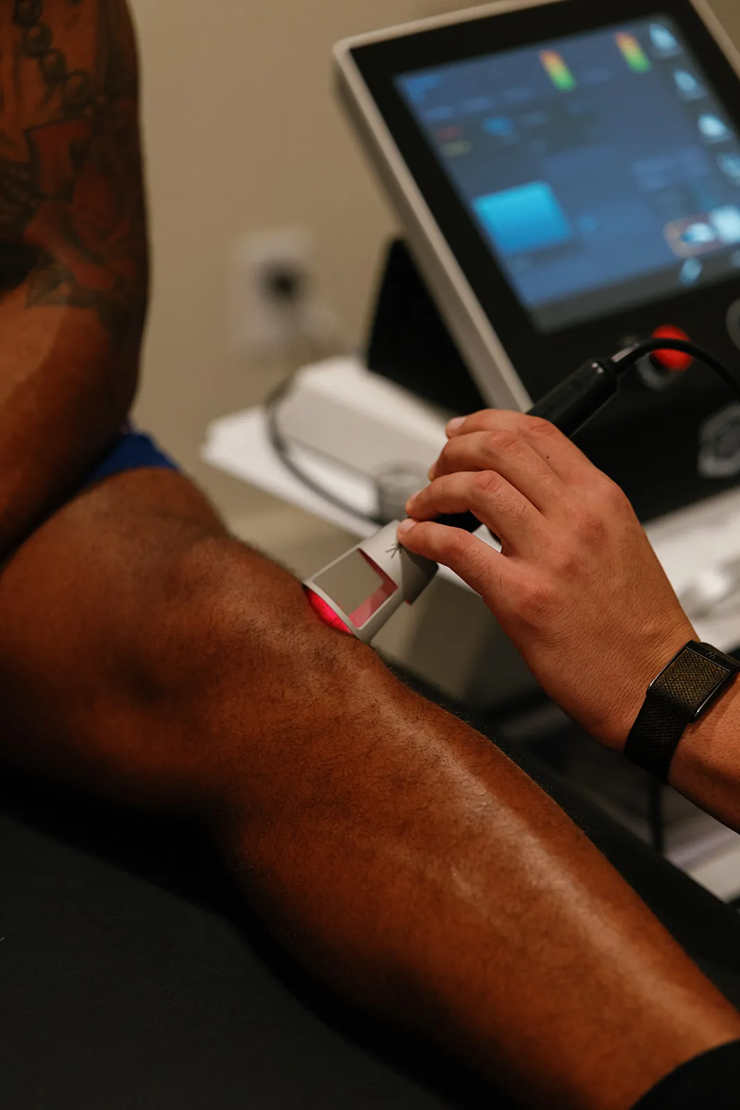 Class IV laser therapy applied to a client's knee at OutRecover